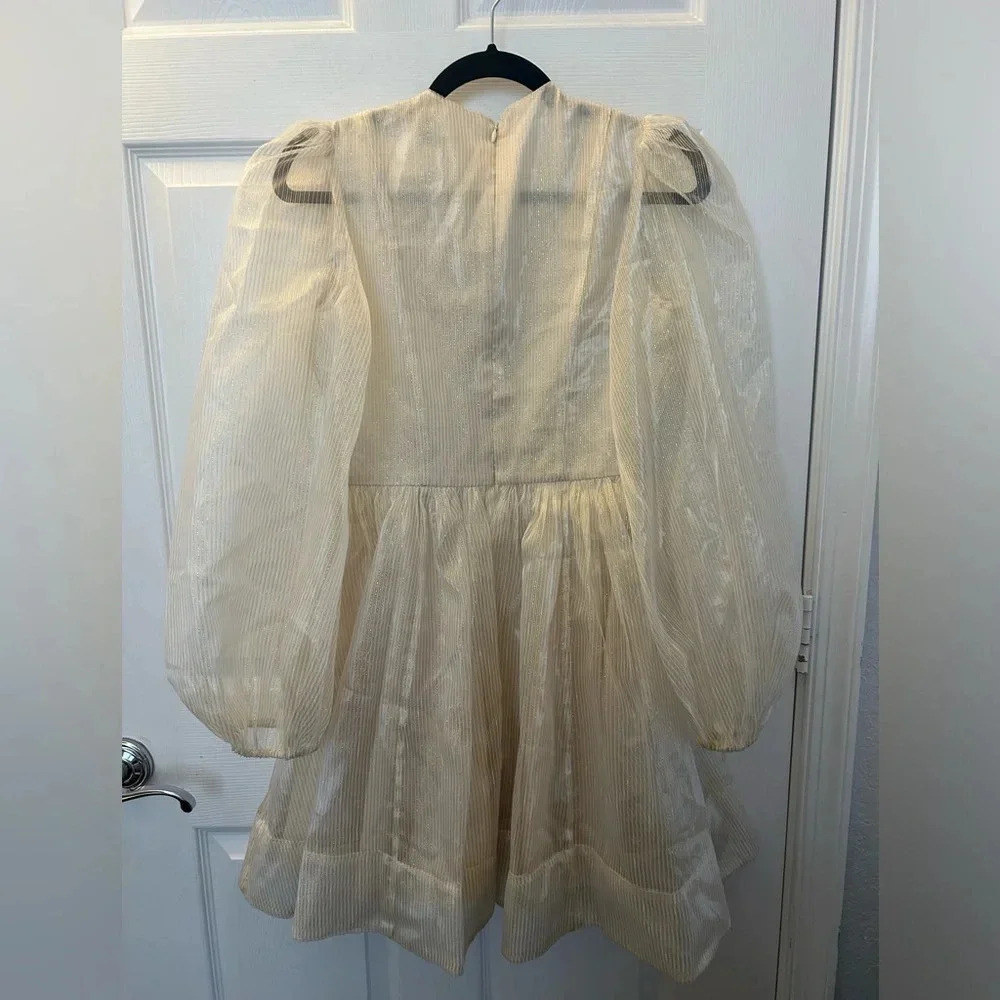 Gold bow front mini dress. Sofie the Label - Picture 5 of 6